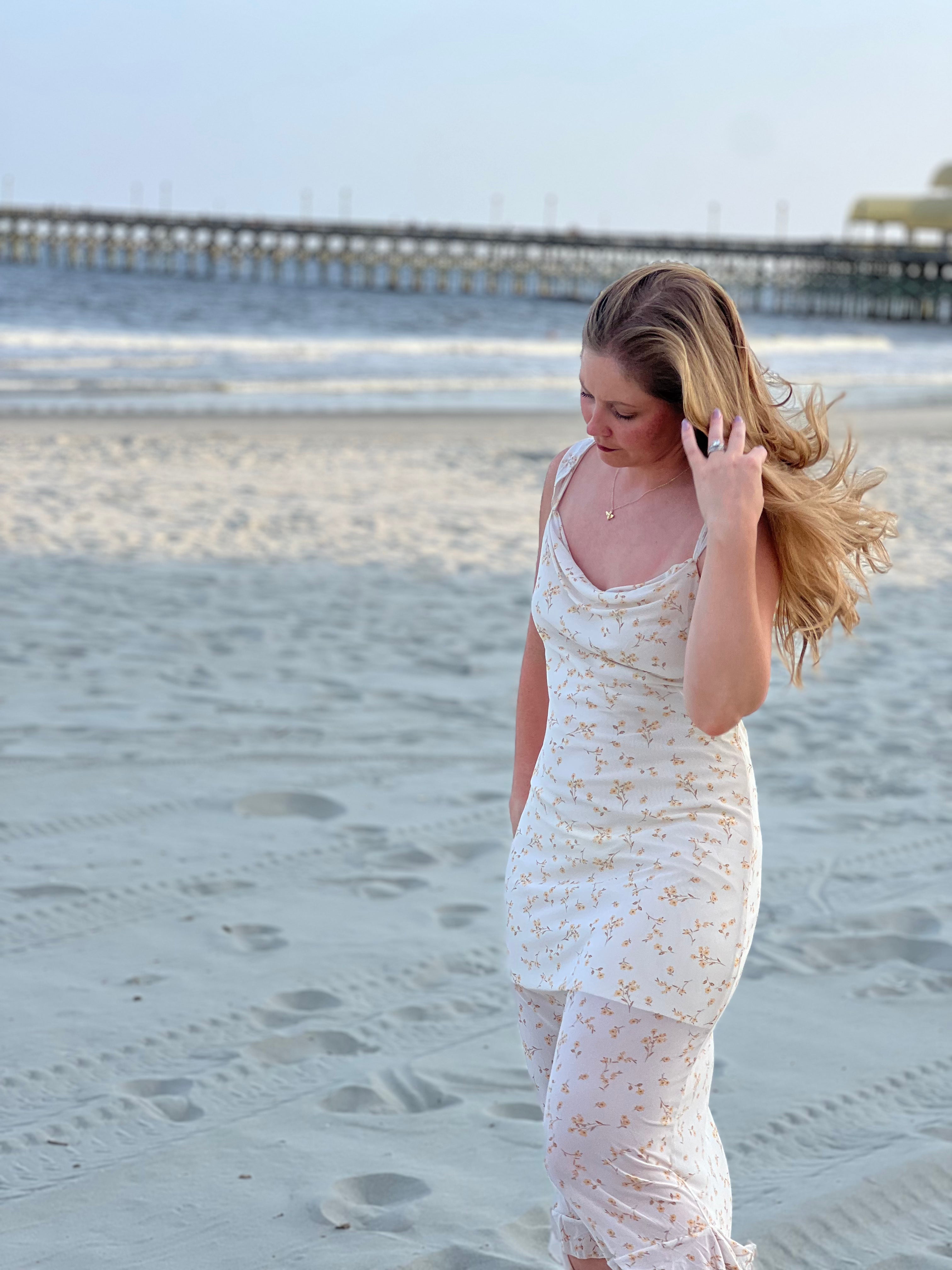 image of woman on beach at sunset